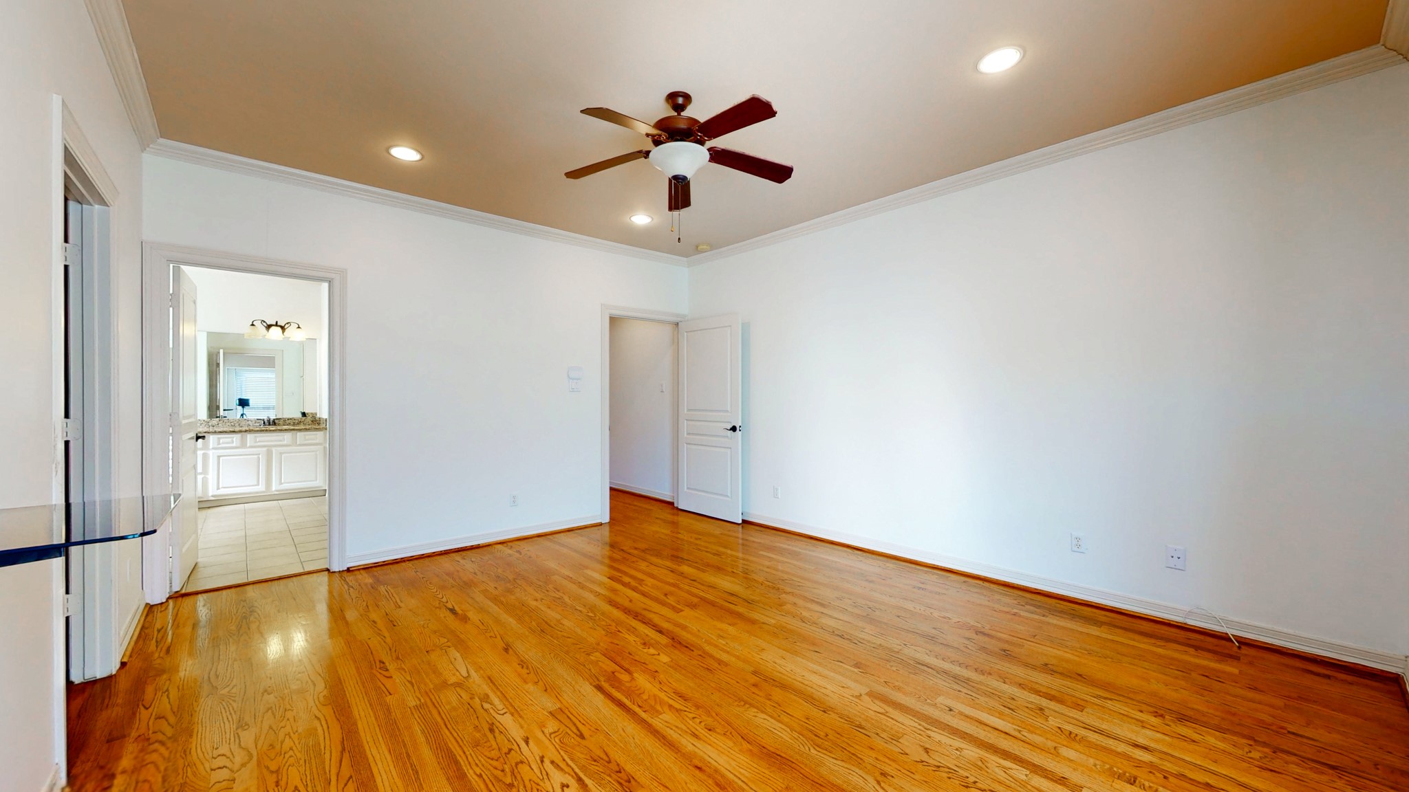 2540 Prospect Street, Unit B Houston, TX 77004 - Photo 13 of 18 wooden floor in an empty room with a window