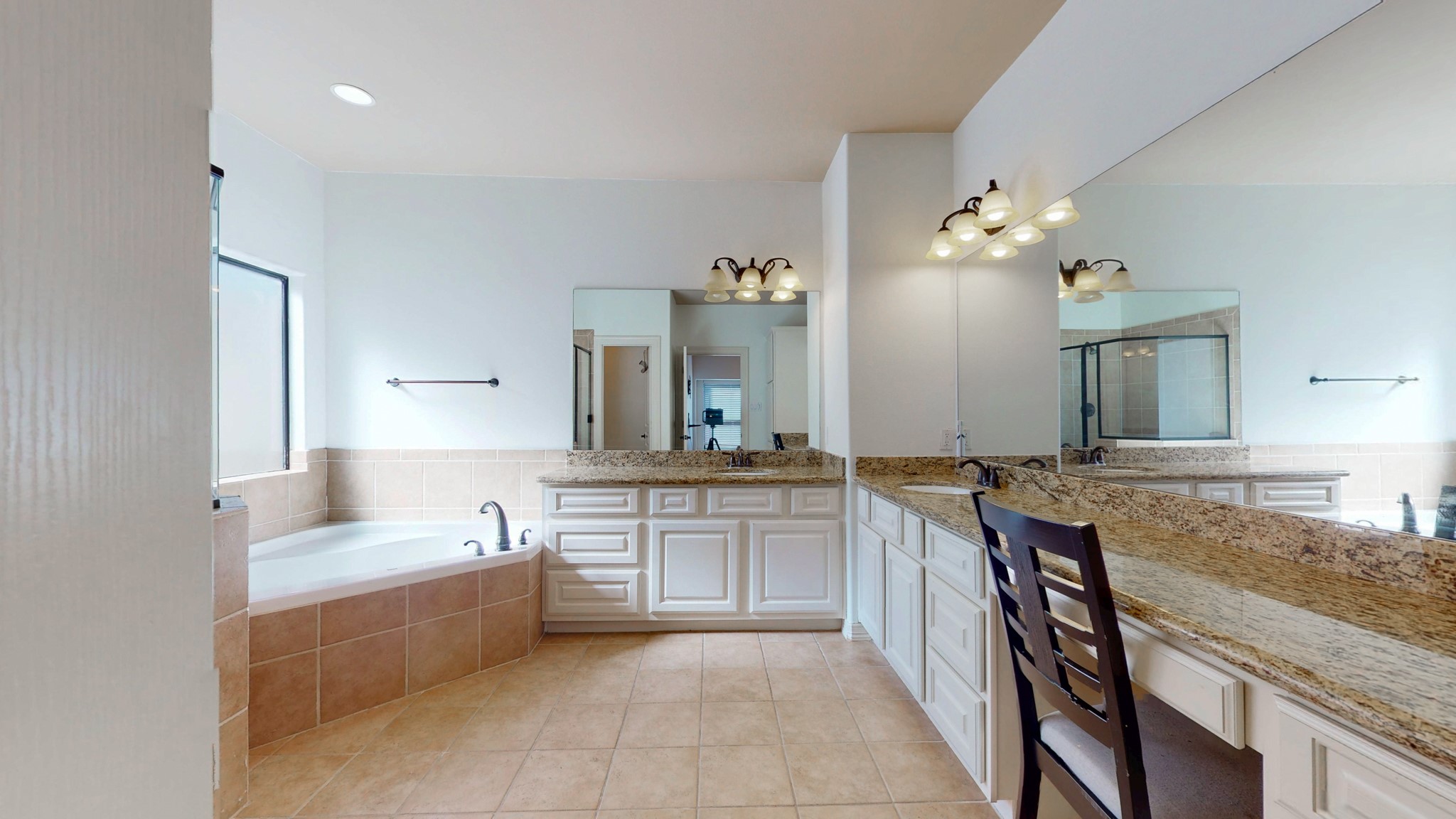 2540 Prospect Street, Unit B Houston, TX 77004 - Photo 14 of 18 a large bathroom with a granite countertop double vanity sink a mirror a bathtub and shower