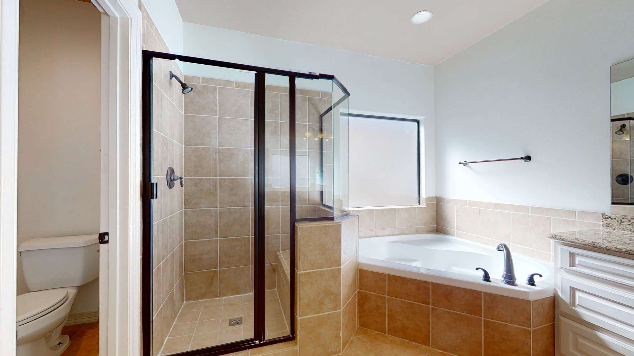 2540 Prospect Street, Unit B Houston, TX 77004 - Photo 15 of 18 a bathroom with a tub a sink and a large mirror