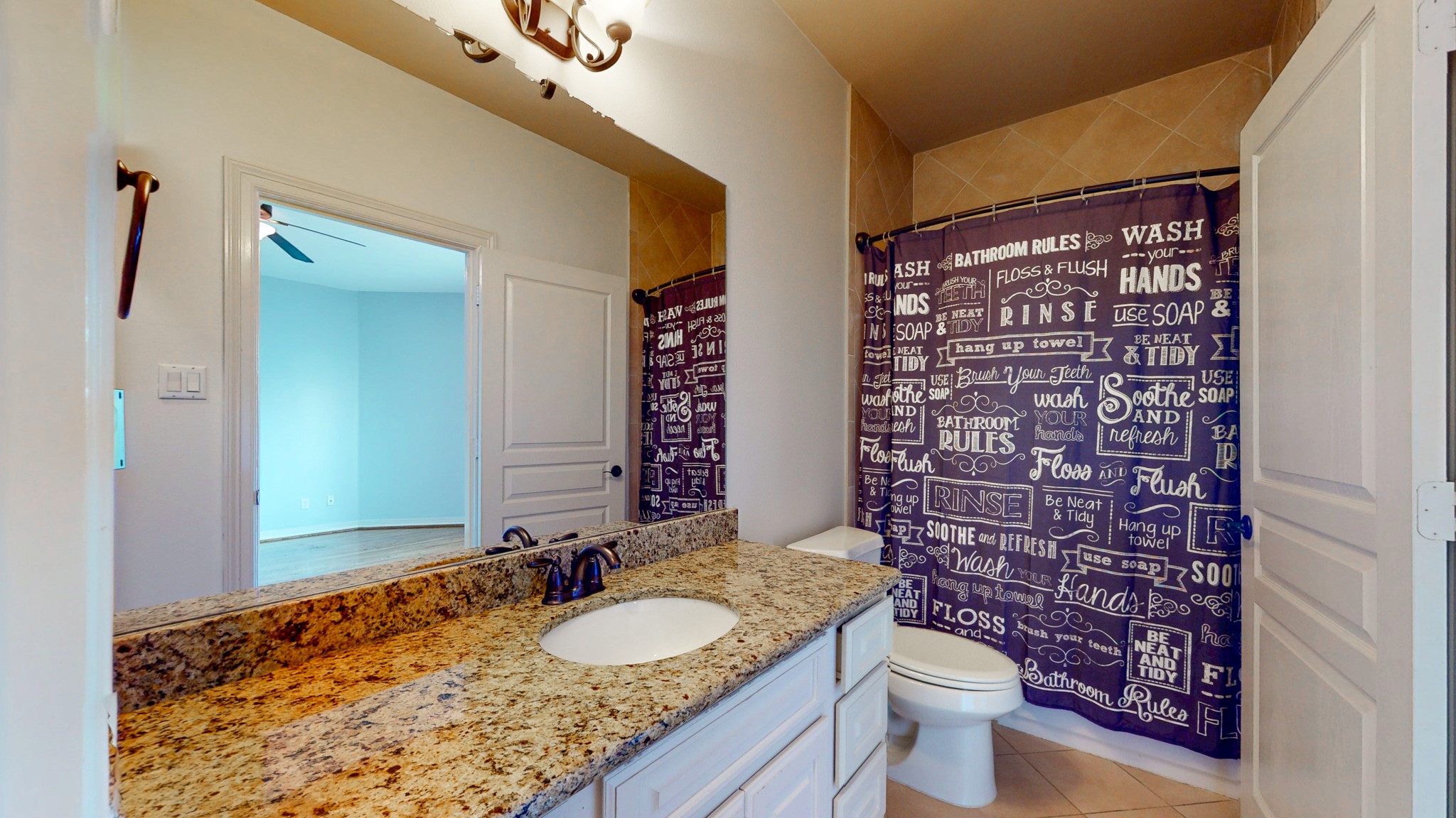 2540 Prospect Street, Unit B Houston, TX 77004 - Photo 17 of 18 a bathroom with a granite countertop sink toilet and shower