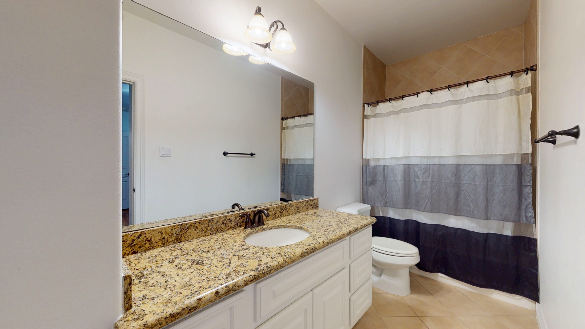 2540 Prospect Street, Unit B Houston, TX 77004 - Photo 9 of 18 a bathroom with a granite countertop sink and a mirror