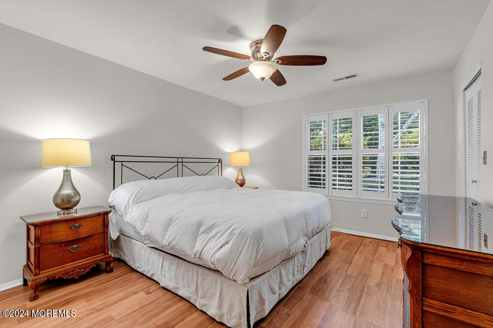 39 Firethorn Circle, Unit 339 Red Bank, NJ 07701 - Photo 6 of 16 a bedroom with a bed and window