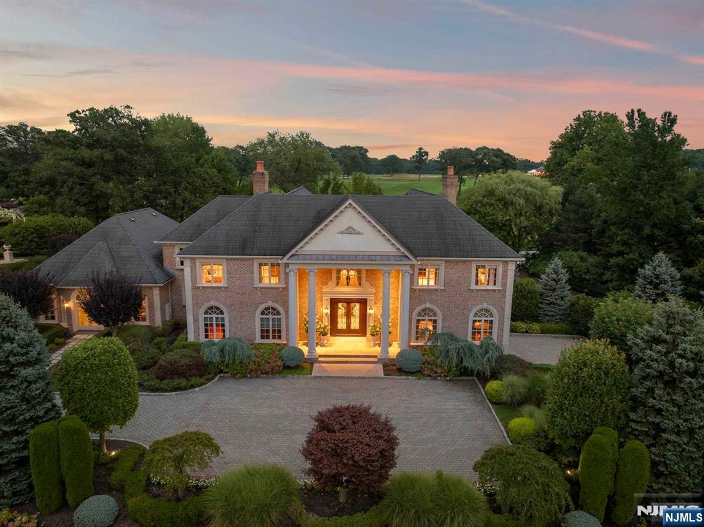 196 Vaccaro Drive Alpine, NJ 07620 - Photo 12 of 50 a front view of a house with a garden