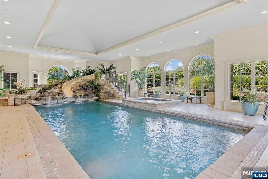 196 Vaccaro Drive Alpine, NJ 07620 - Photo 19 of 50 a view of a living room and floor to ceiling window or swimming pool