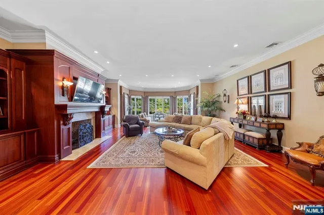 a living room with fireplace furniture and a flat screen tv