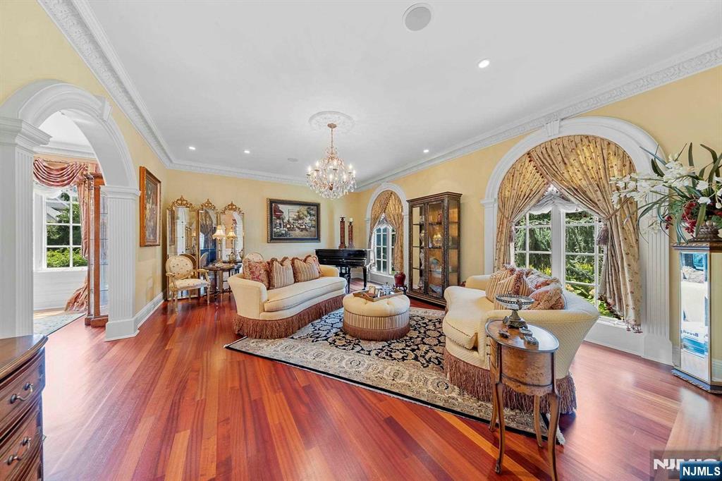 196 Vaccaro Drive Alpine, NJ 07620 - Photo 22 of 50 a living room with fireplace furniture and a large window