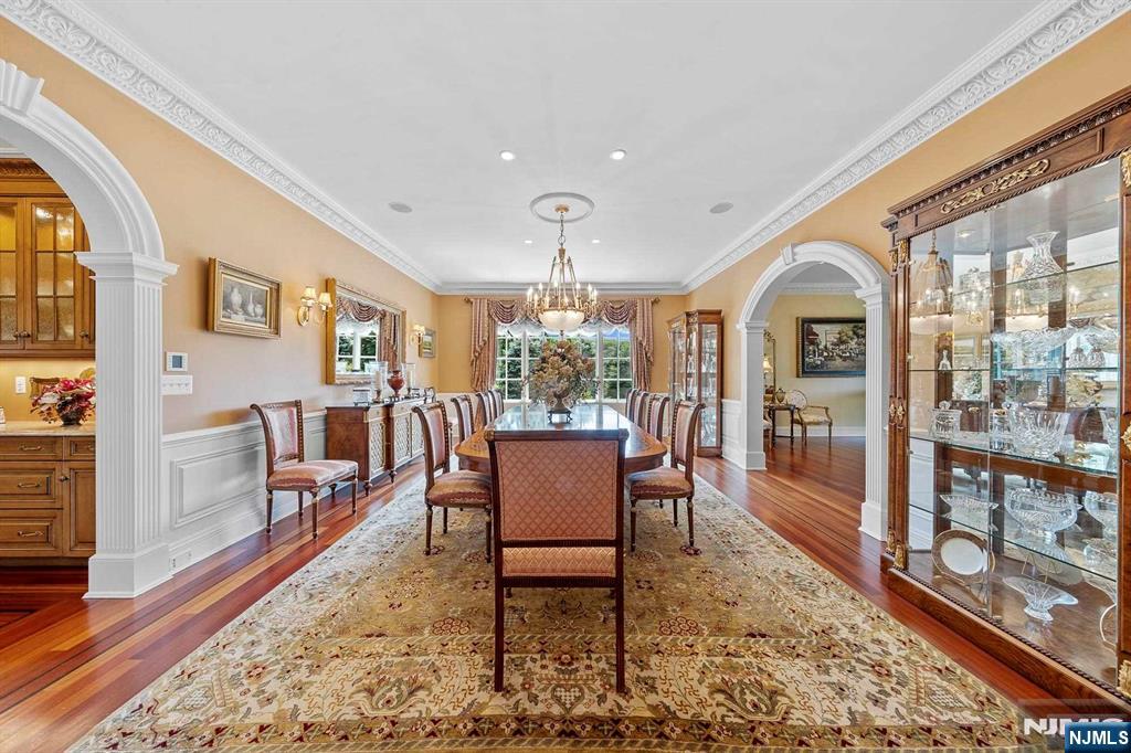 196 Vaccaro Drive Alpine, NJ 07620 - Photo 23 of 50 a dining room with furniture a rug and wooden floor