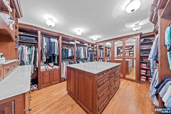 a bedroom with furniture and a chandelier