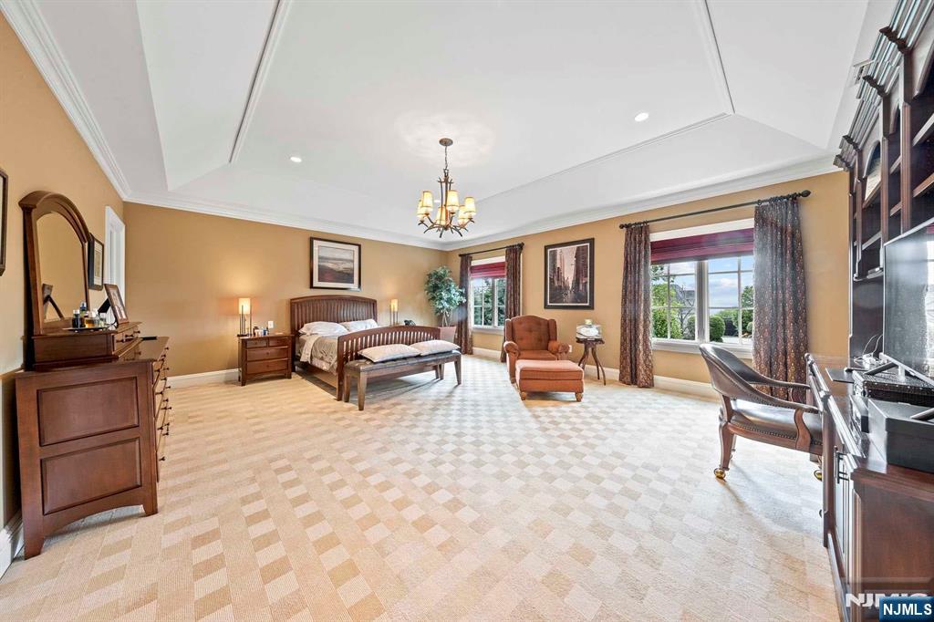196 Vaccaro Drive Alpine, NJ 07620 - Photo 37 of 50 a living room with furniture large window and flat screen tv
