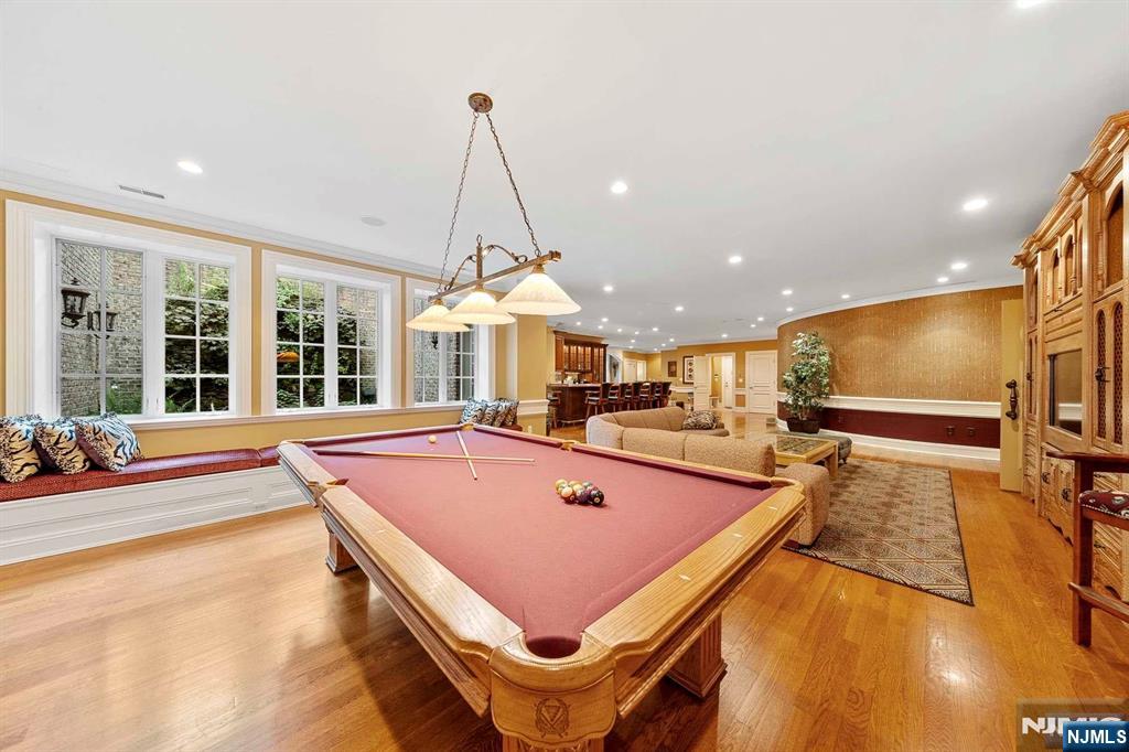 196 Vaccaro Drive Alpine, NJ 07620 - Photo 42 of 50 a living room with pool table furniture and a flat screen tv