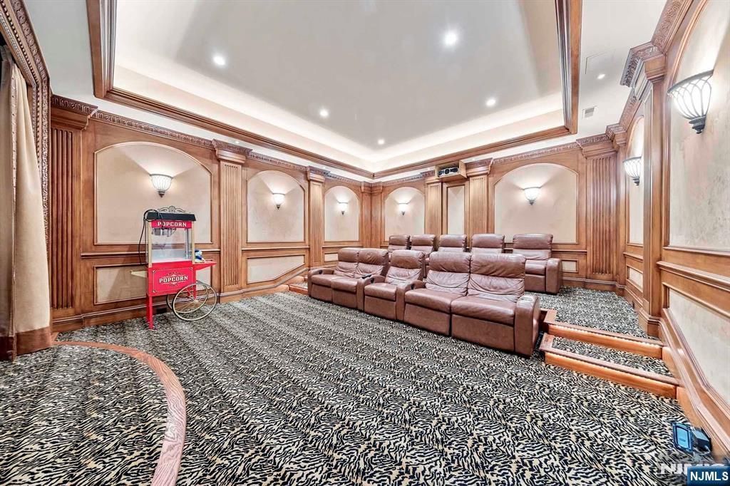 196 Vaccaro Drive Alpine, NJ 07620 - Photo 44 of 50 a living room with furniture a rug and kitchen view