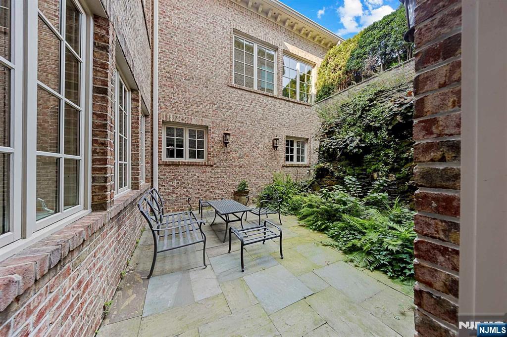 196 Vaccaro Drive Alpine, NJ 07620 - Photo 45 of 50 a backyard of a house with outdoor seating