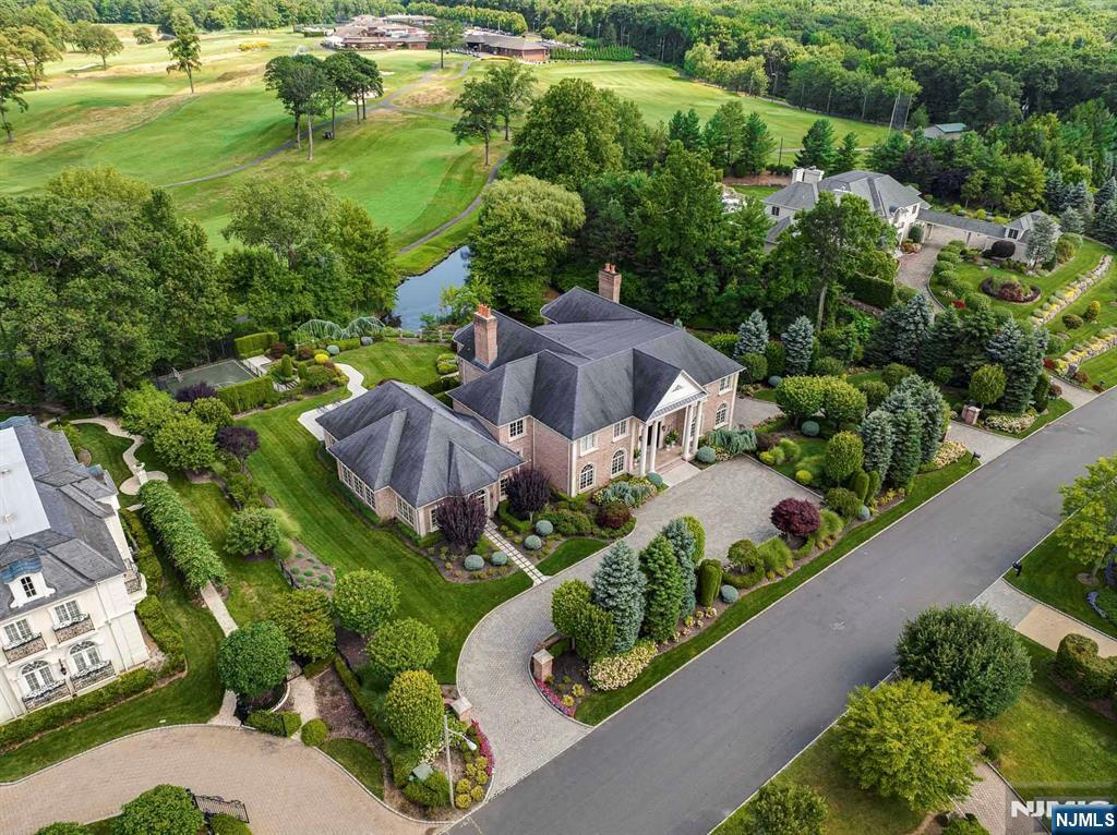 196 Vaccaro Drive Alpine, NJ 07620 - Photo 48 of 50 an aerial view of a house with a garden and lake view