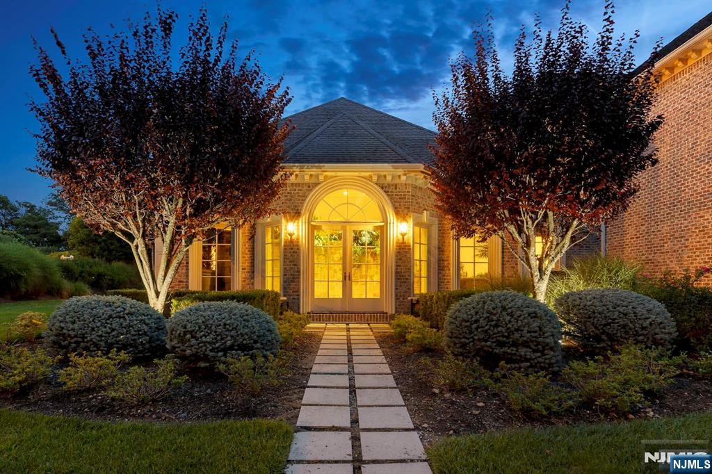 196 Vaccaro Drive Alpine, NJ 07620 - Photo 6 of 50 a view of a house with large trees and plants