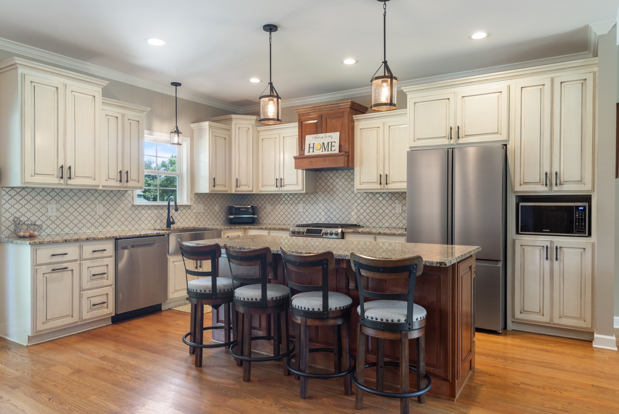 3215 Church Street Burns, TN 37029 - Photo 11 of 46 a kitchen with stainless steel appliances granite countertop a kitchen island hardwood floor and a sink
