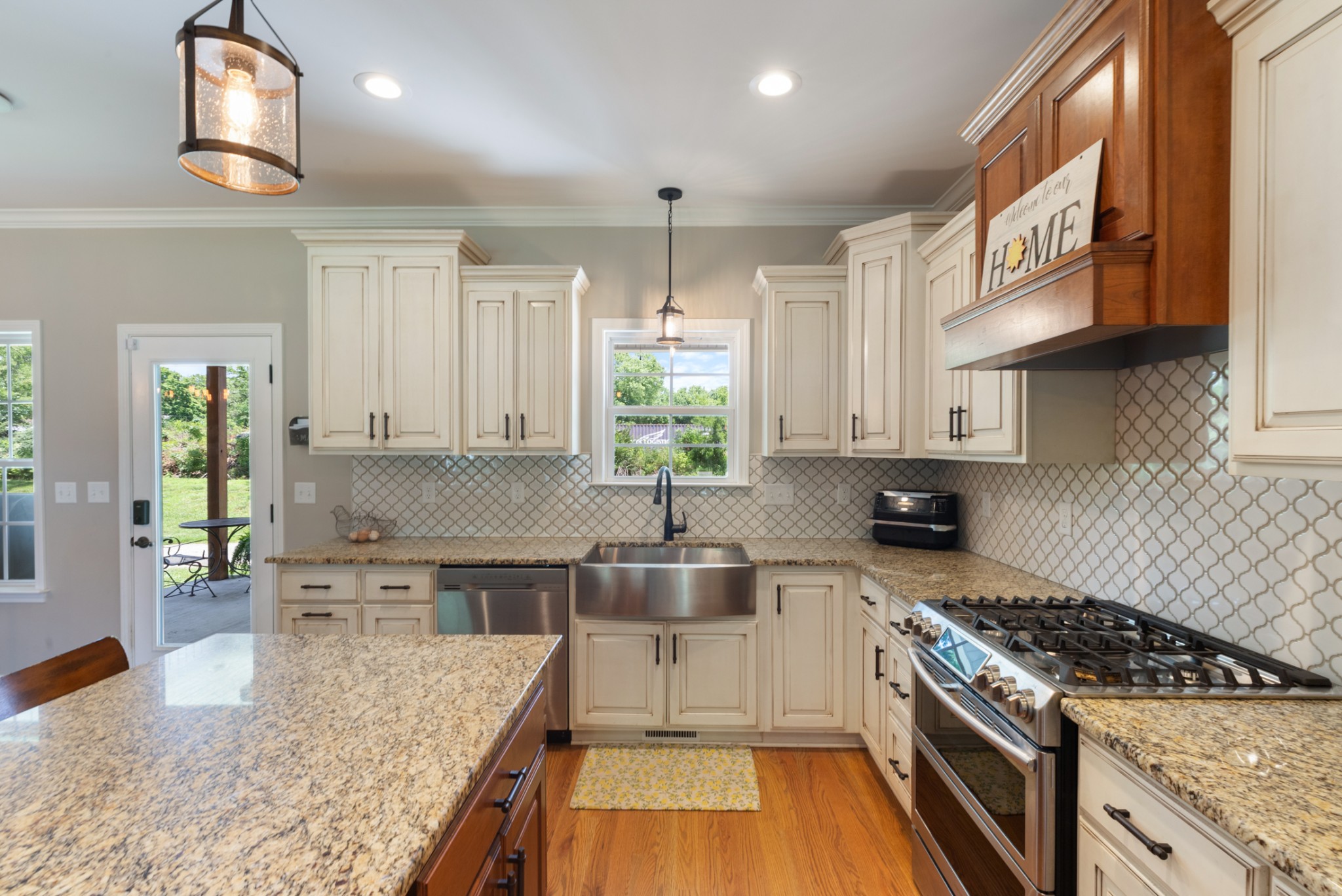3215 Church Street Burns, TN 37029 - Photo 15 of 46 a kitchen with kitchen island granite countertop a stove and a sink