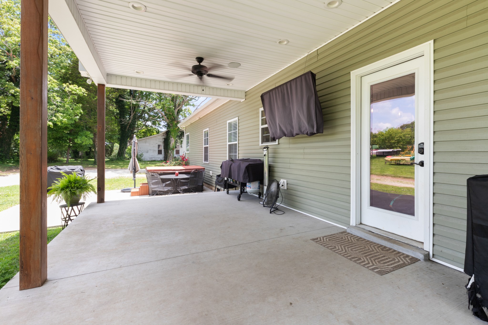 3215 Church Street Burns, TN 37029 - Photo 36 of 46 a view of a porch with furniture and floor to ceiling window