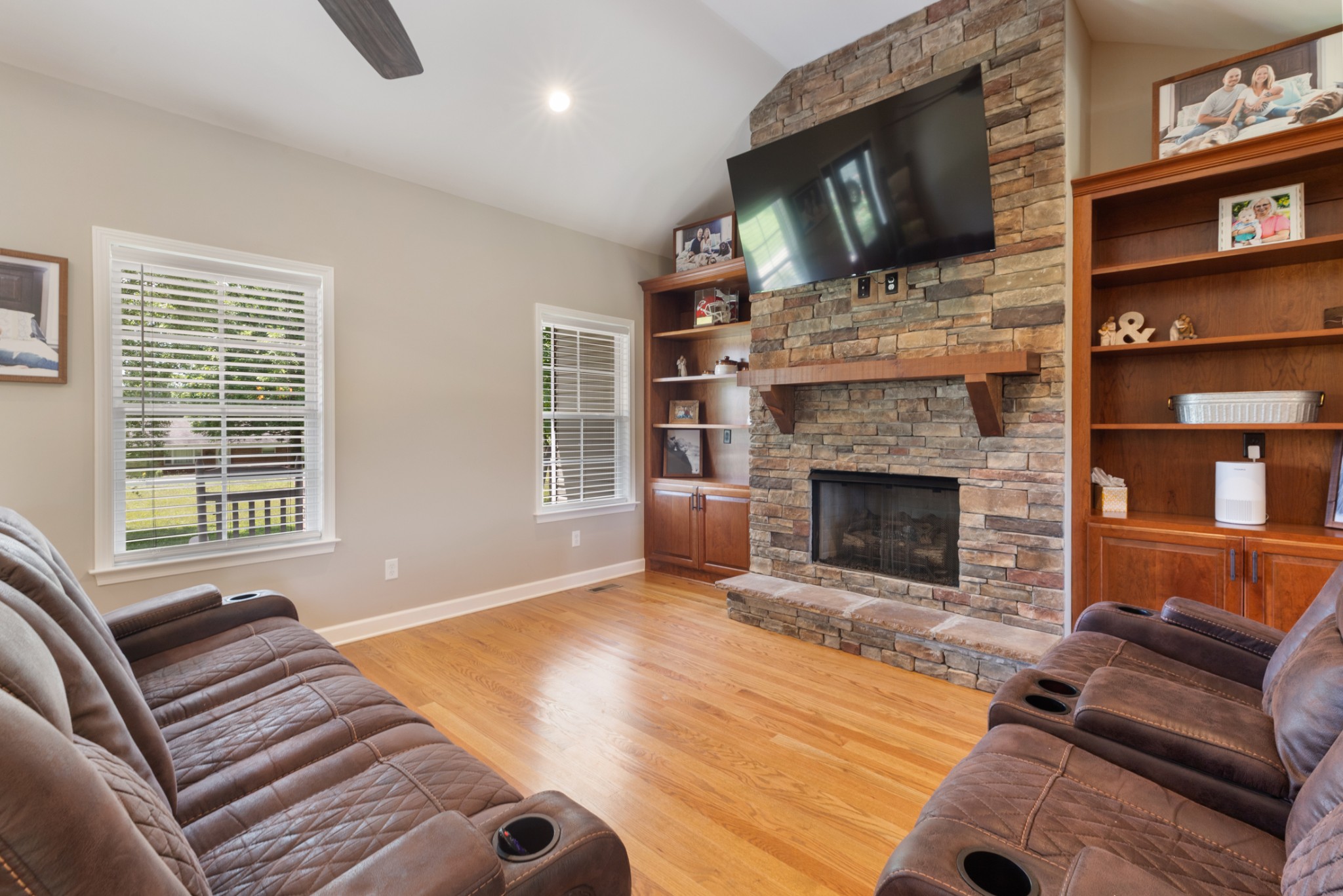 3215 Church Street Burns, TN 37029 - Photo 9 of 46 a living room with furniture a flat screen tv and a fireplace