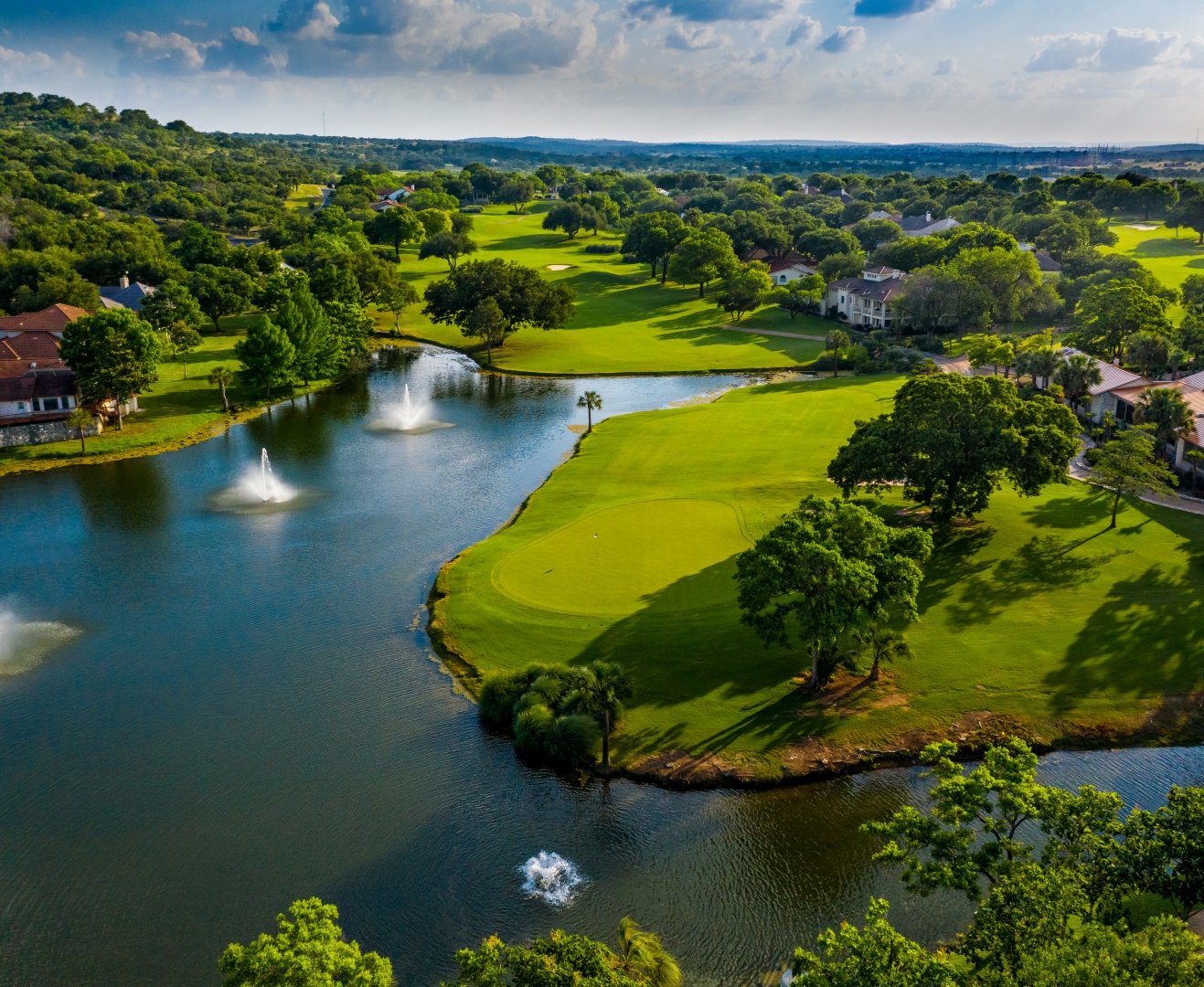 0 Mountain Dew Road Horseshoe Bay, TX 78657 - Photo 18 of 18 Bird's eye view of a nearby body of water, a golf club, and a tree filled landscape