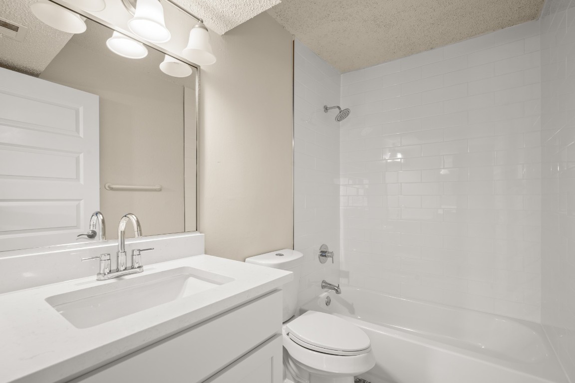 2408 Longview Street, Unit 112 Austin, TX 78705 - Photo 10 of 15 a bathroom with a sink a toilet and shower