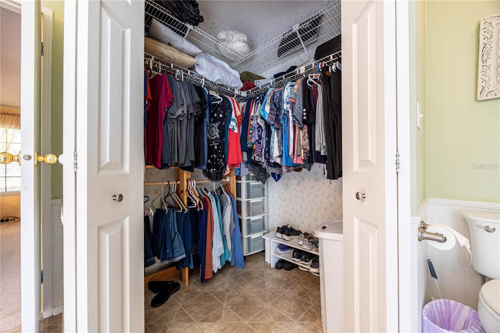 159 Southwest 70th Avenue Bell, FL 32619 - Photo 16 of 42 a view of walk in closet with clothes and shoes