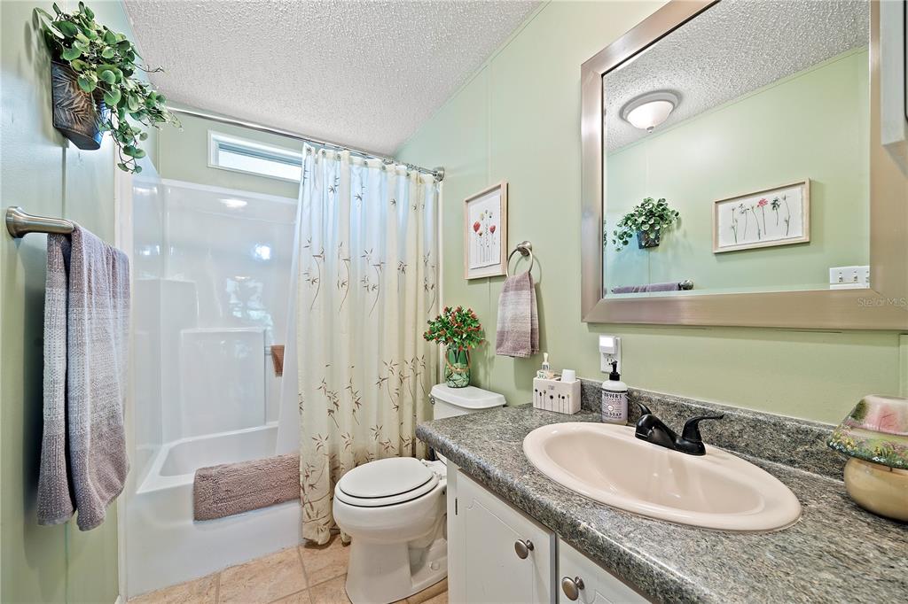 159 Southwest 70th Avenue Bell, FL 32619 - Photo 18 of 42 a bathroom with a sink a toilet and shower