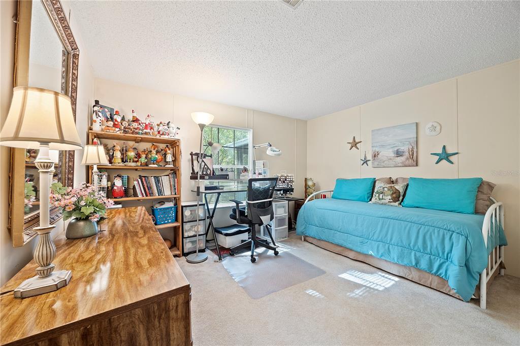 159 Southwest 70th Avenue Bell, FL 32619 - Photo 19 of 42 a bedroom with furniture and a large window