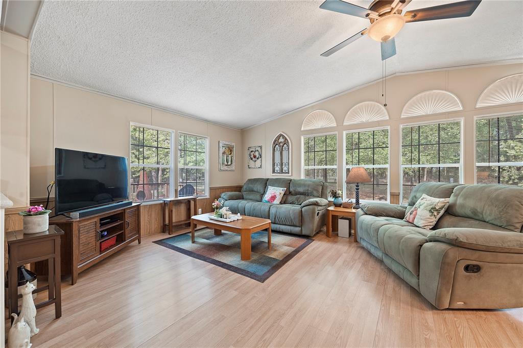 159 Southwest 70th Avenue Bell, FL 32619 - Photo 3 of 42 a living room with furniture and a flat screen tv