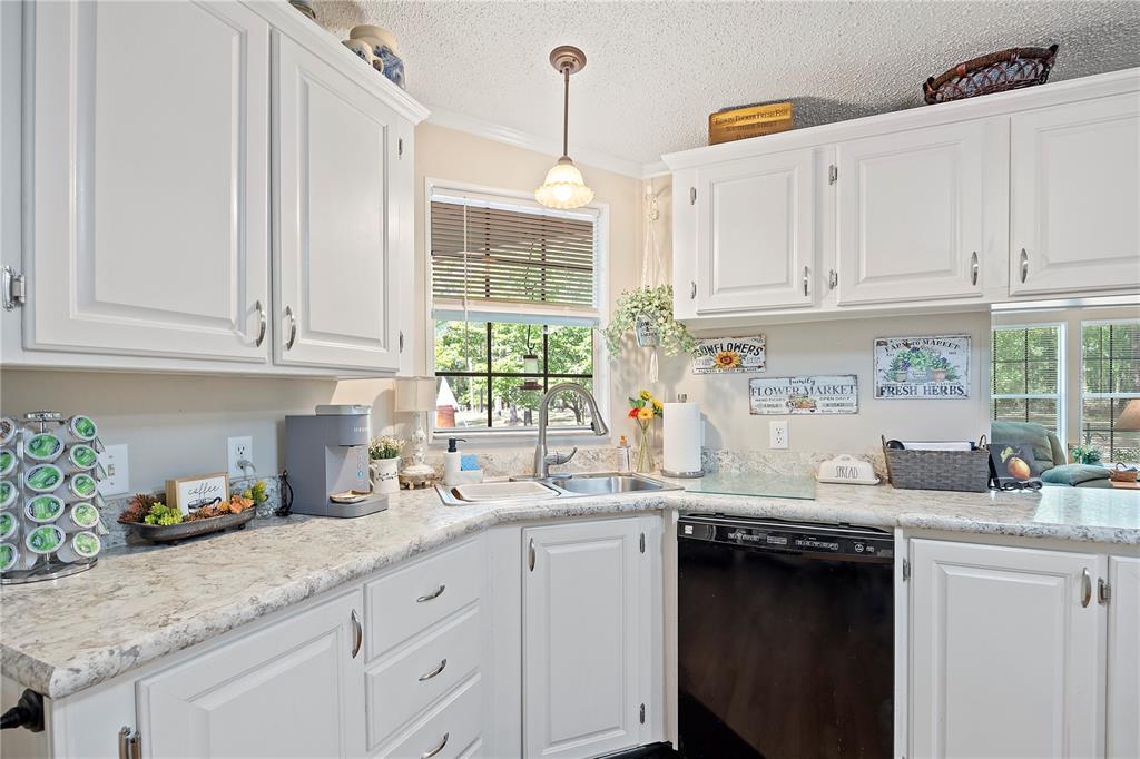 159 Southwest 70th Avenue Bell, FL 32619 - Photo 6 of 42 a kitchen with stainless steel appliances granite countertop a sink a stove and cabinets