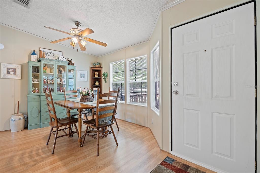 159 Southwest 70th Avenue Bell, FL 32619 - Photo 7 of 42 a view of a dining room with furniture wooden floor and chandelier