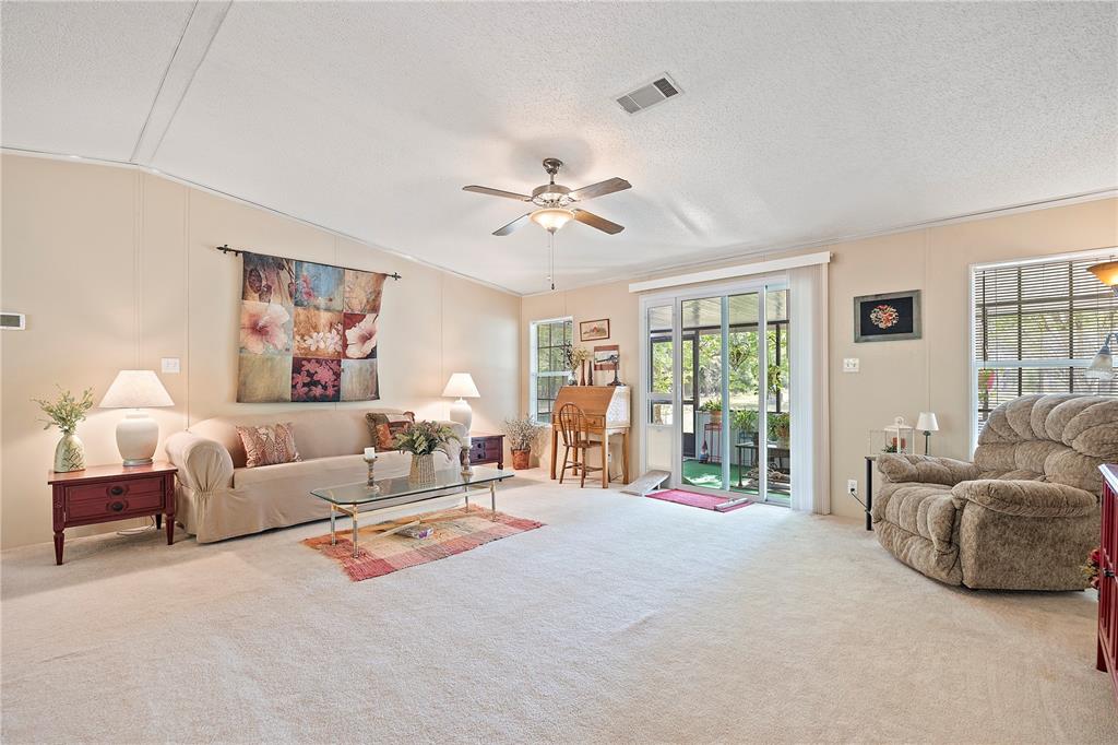 159 Southwest 70th Avenue Bell, FL 32619 - Photo 9 of 42 a living room with furniture and a large window