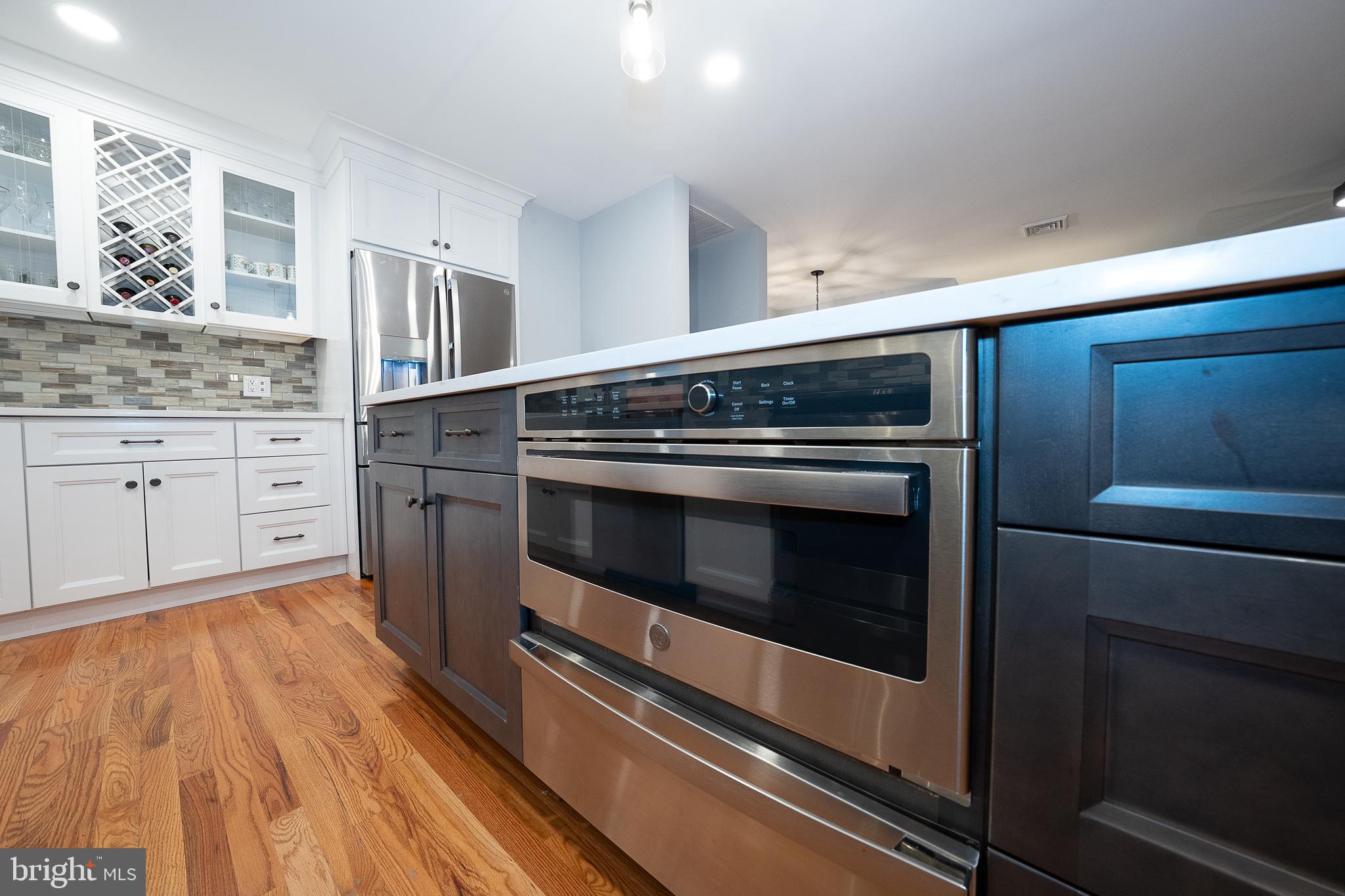 950 Spring City Road Phoenixville, PA 19460 - Photo 13 of 43 a kitchen with granite countertop cabinets stainless steel appliances and wooden floor