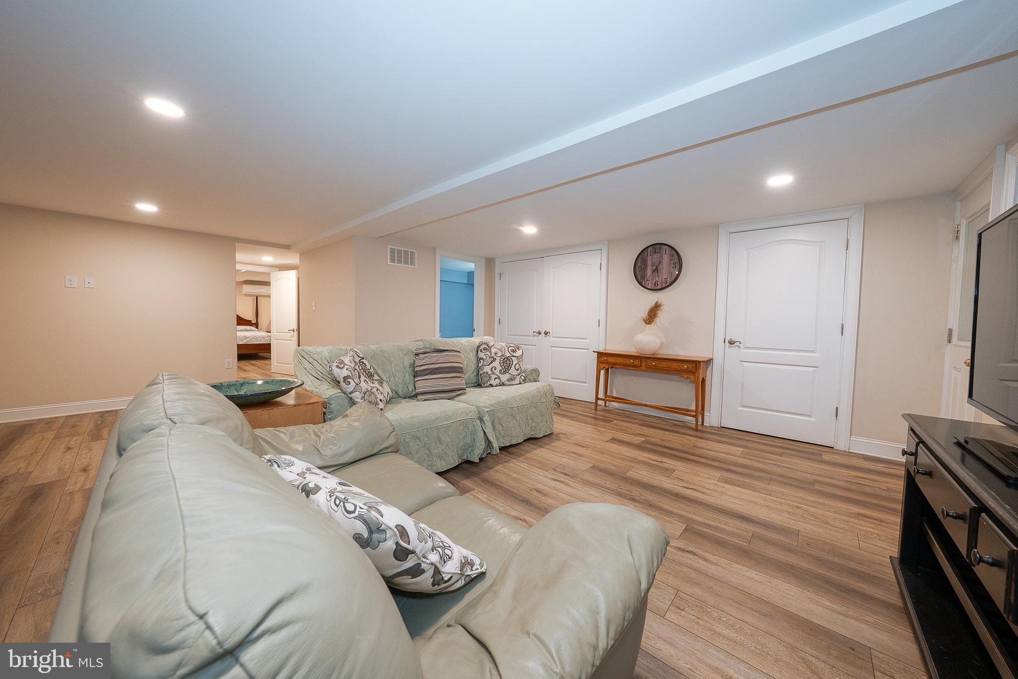 950 Spring City Road Phoenixville, PA 19460 - Photo 24 of 43 a large bedroom with a bed and a wooden floor