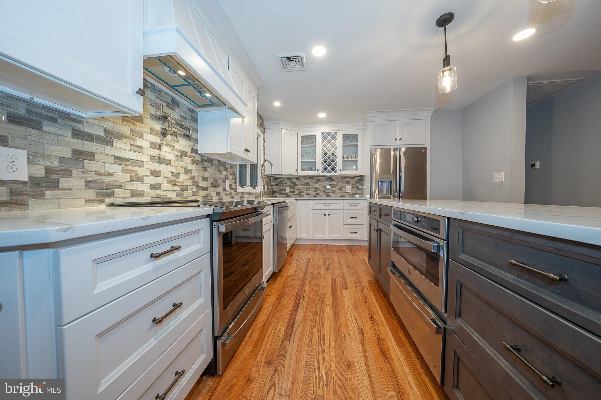 950 Spring City Road Phoenixville, PA 19460 - Photo 3 of 43 a large kitchen with cabinets wooden floor and stainless steel appliances