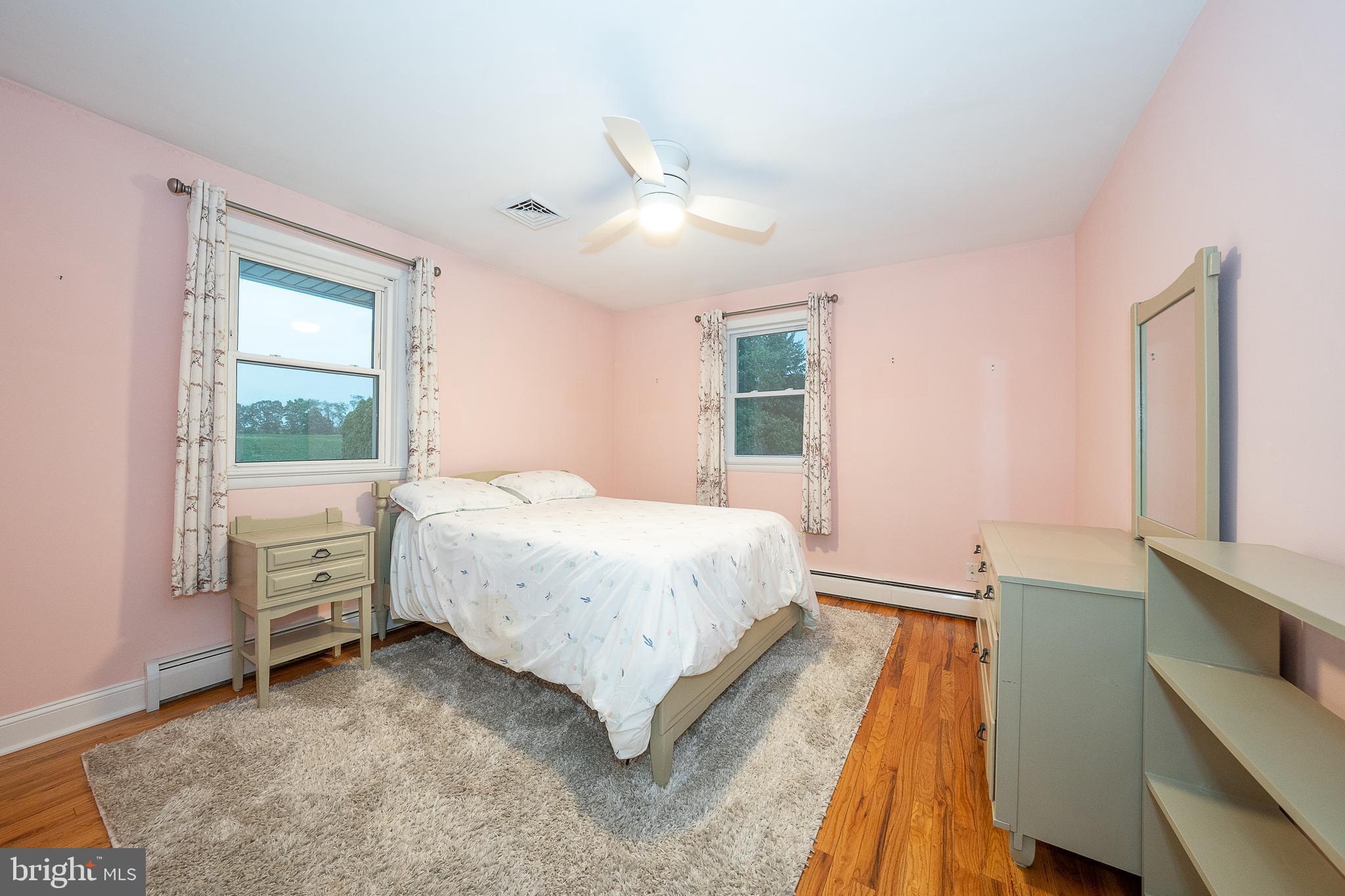950 Spring City Road Phoenixville, PA 19460 - Photo 33 of 43 a spacious bedroom with a bed and a window