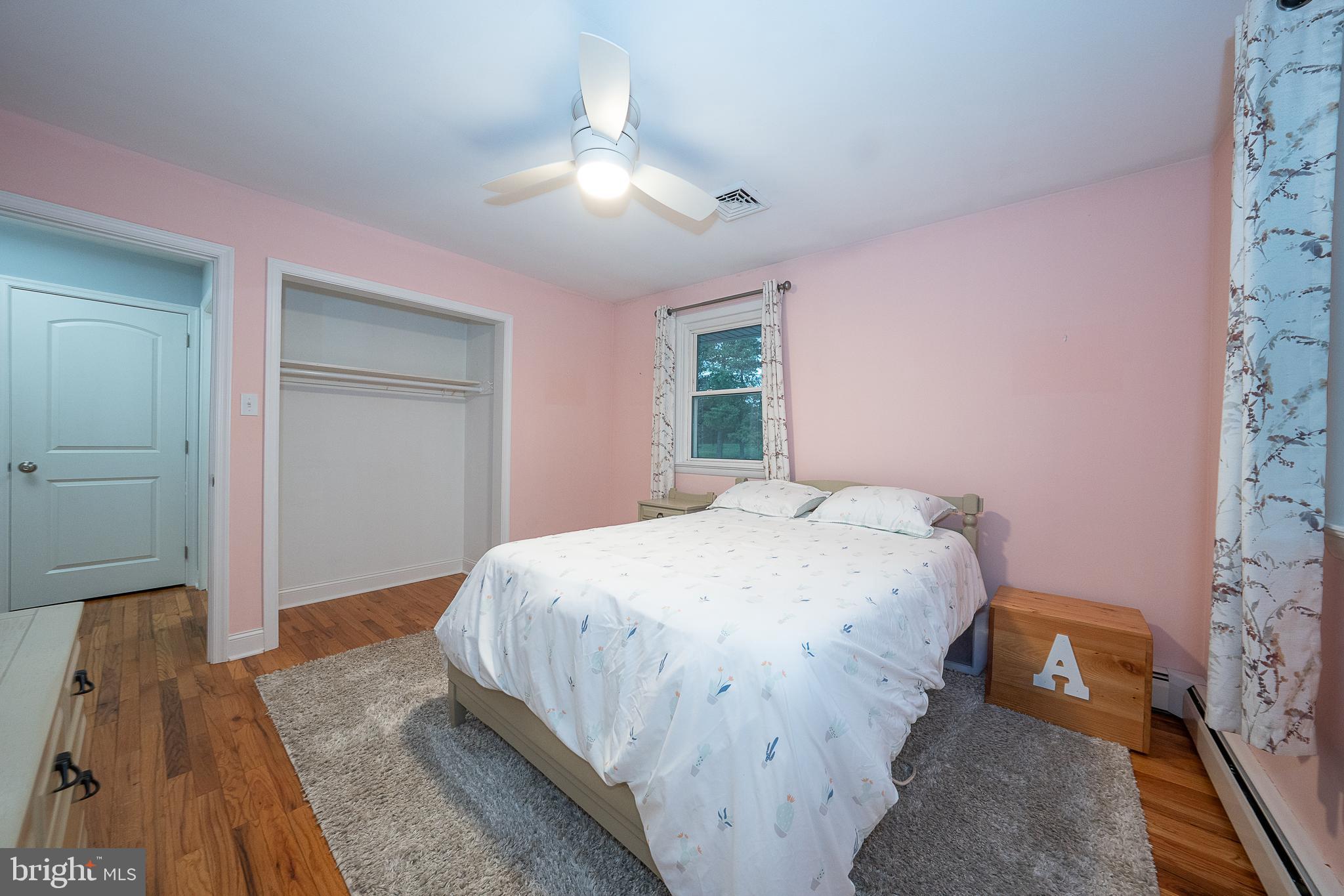 950 Spring City Road Phoenixville, PA 19460 - Photo 34 of 43 a bedroom with a bed and a chandelier