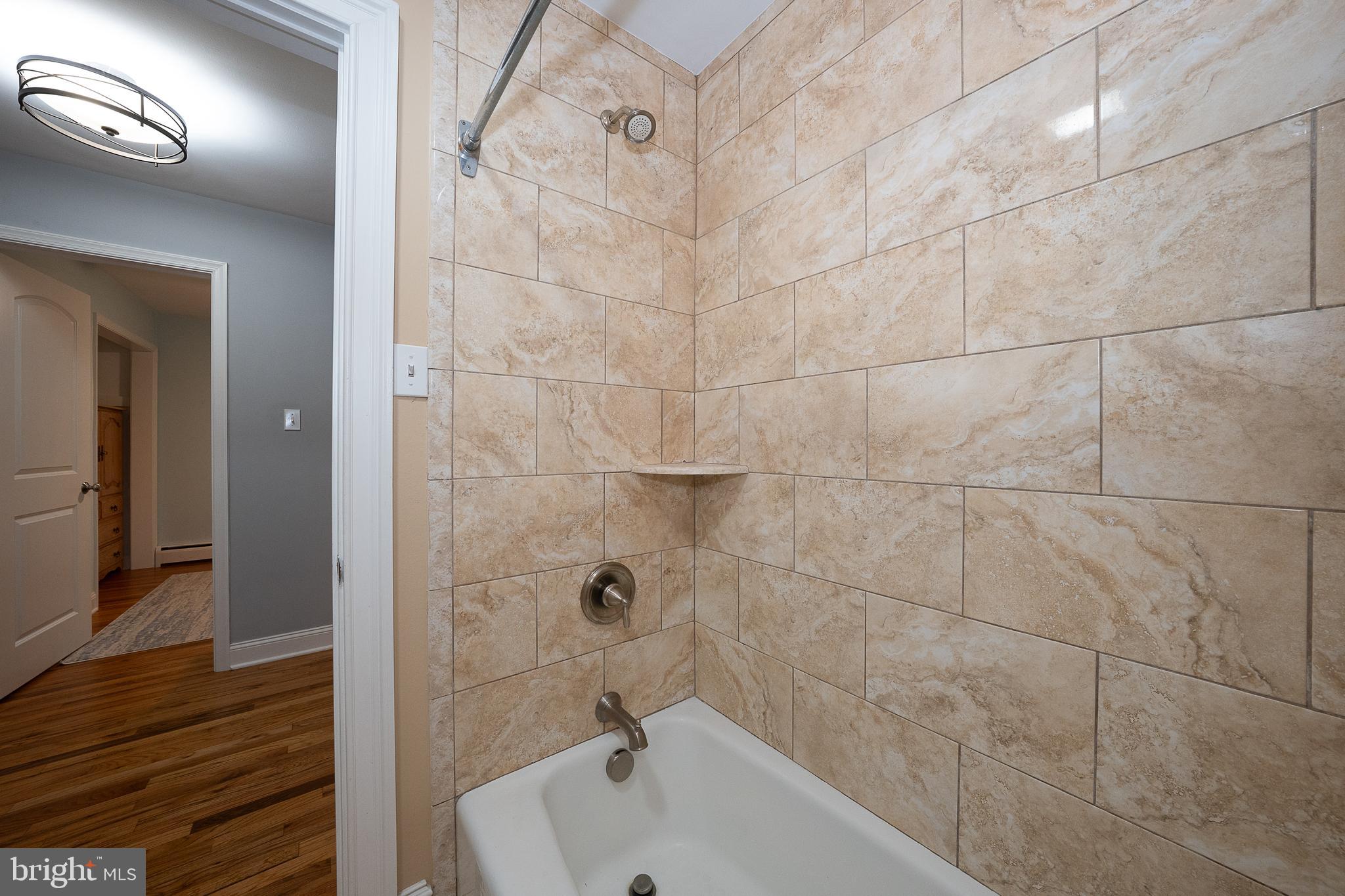950 Spring City Road Phoenixville, PA 19460 - Photo 36 of 43 a bathroom with a sink and shower