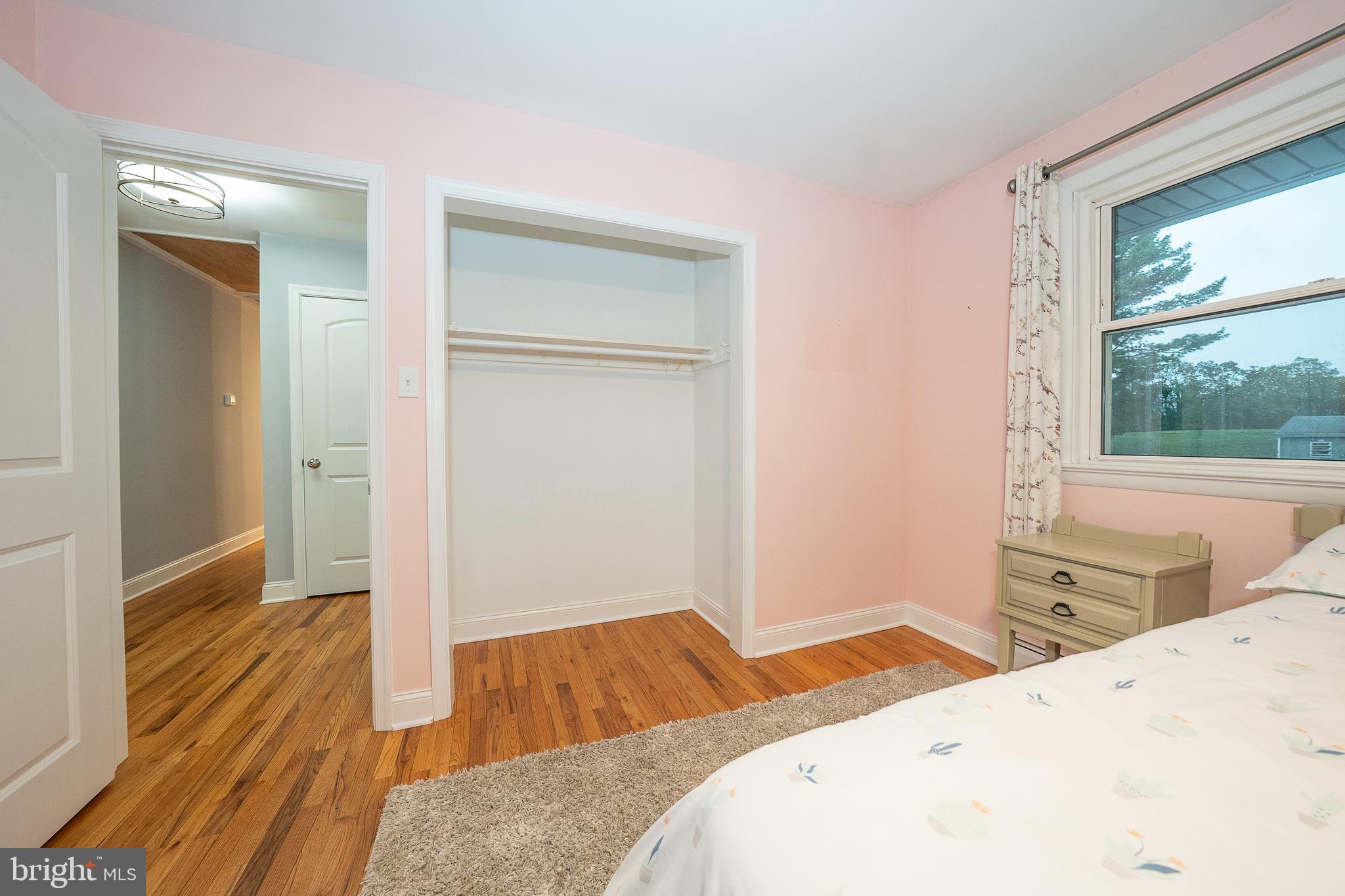 950 Spring City Road Phoenixville, PA 19460 - Photo 41 of 43 a bedroom with a bed and wooden floor