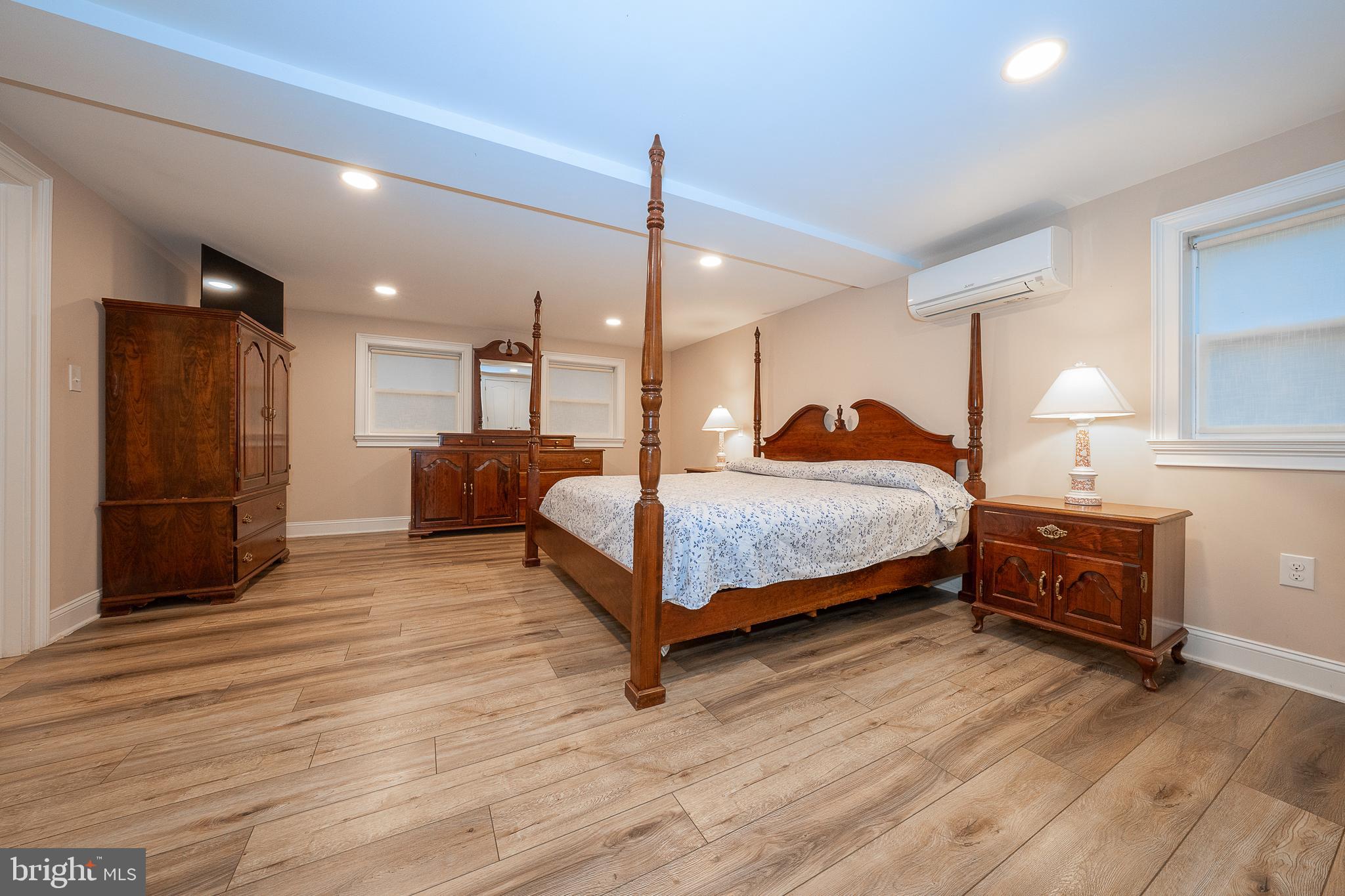 950 Spring City Road Phoenixville, PA 19460 - Photo 42 of 43 a bedroom with a bed dresser and a wooden floor