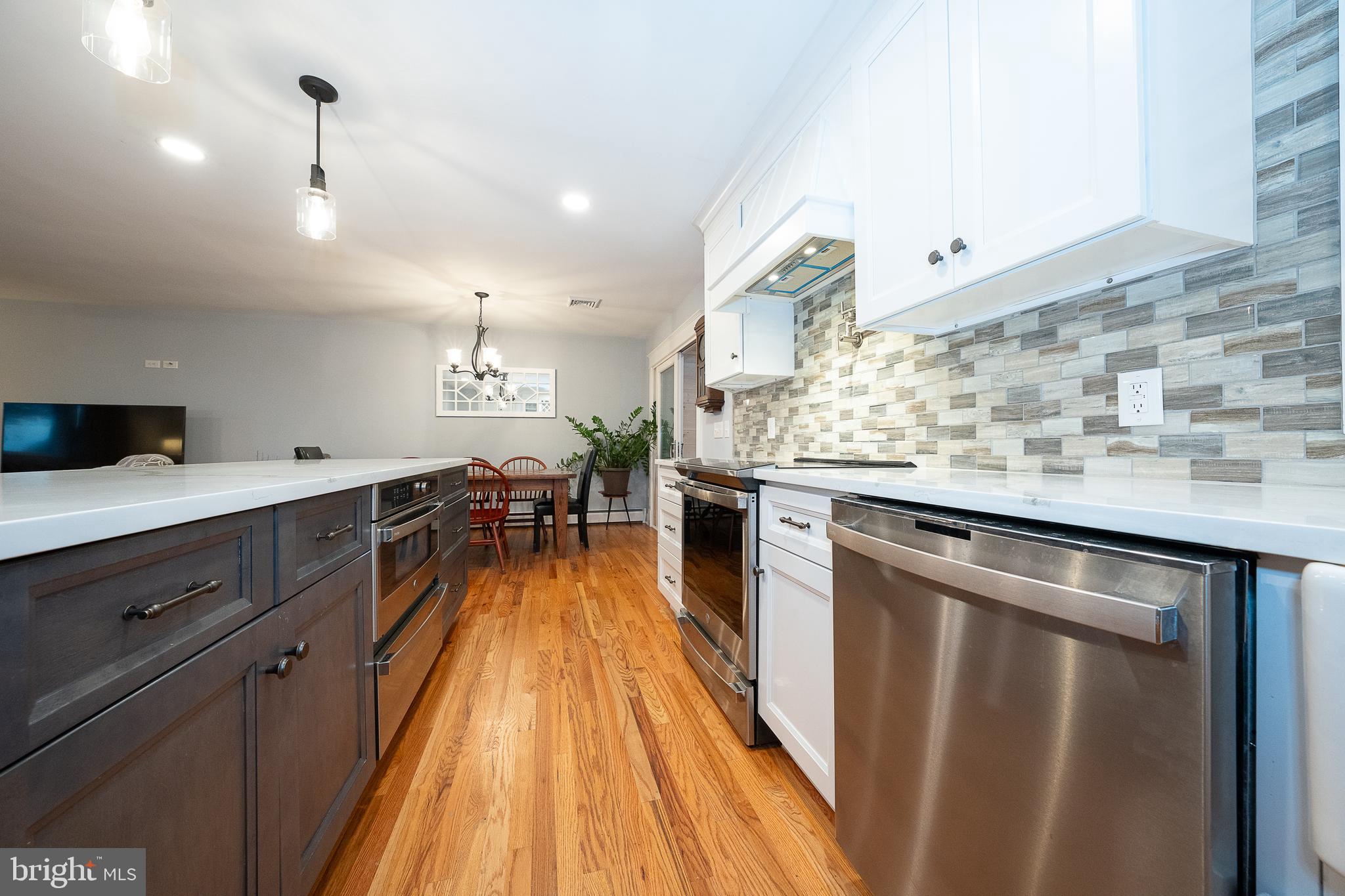 950 Spring City Road Phoenixville, PA 19460 - Photo 9 of 43 a kitchen with a sink and wooden floor