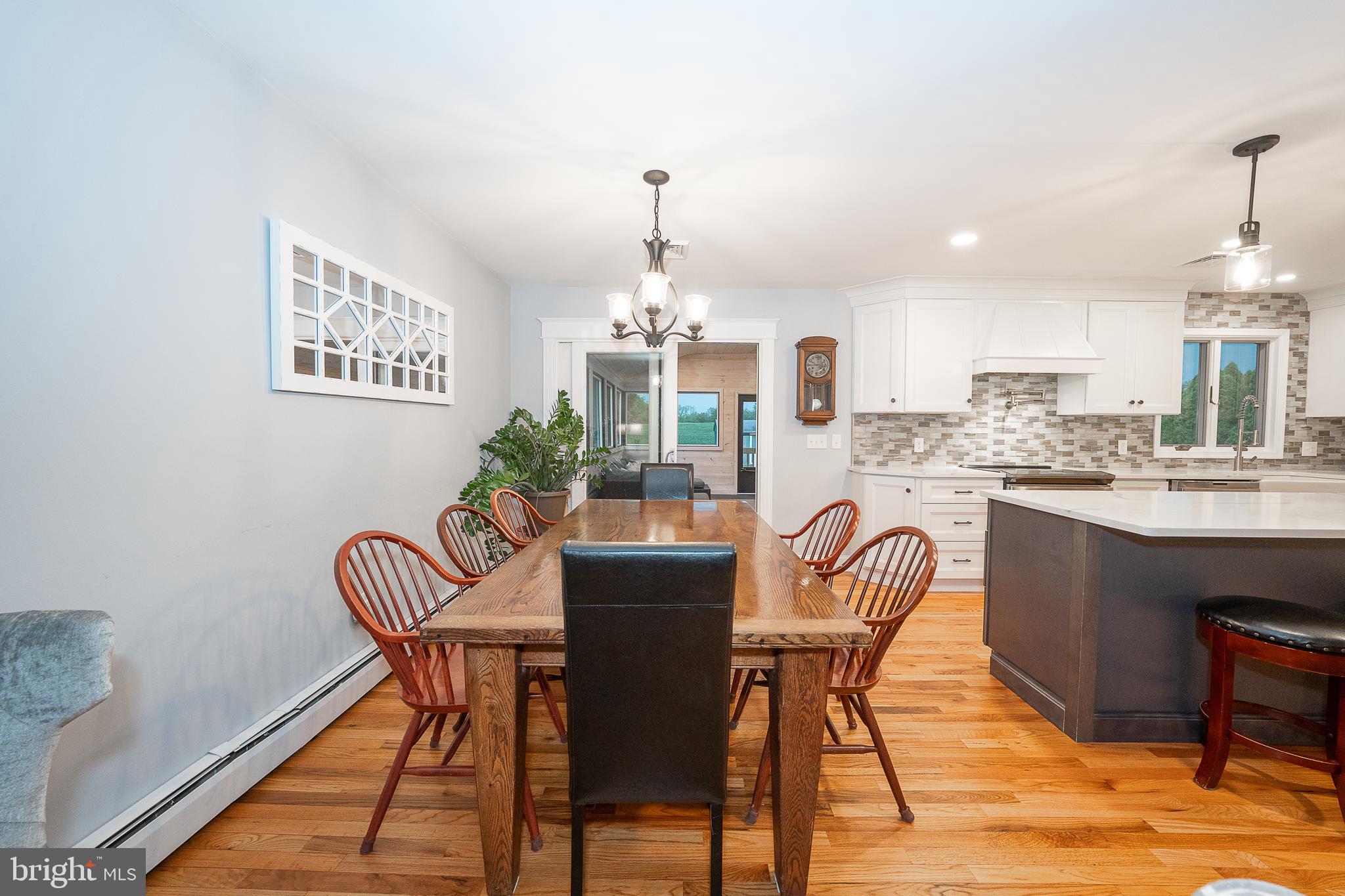 950 Spring City Road Phoenixville, PA 19460 - Photo 10 of 43 a dining room with furniture a chandelier and wooden floor