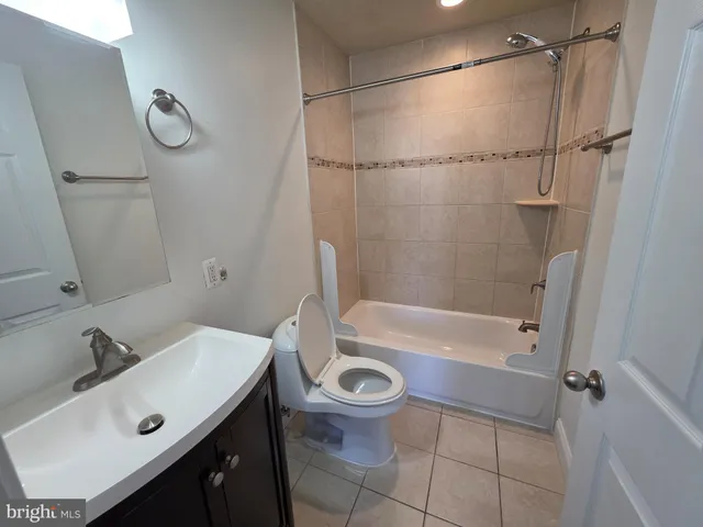 a bathroom with a sink a toilet and a bathtub