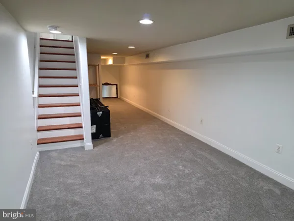 a view of a room with a staircase