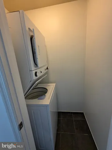a bathroom with a sink and washing machine