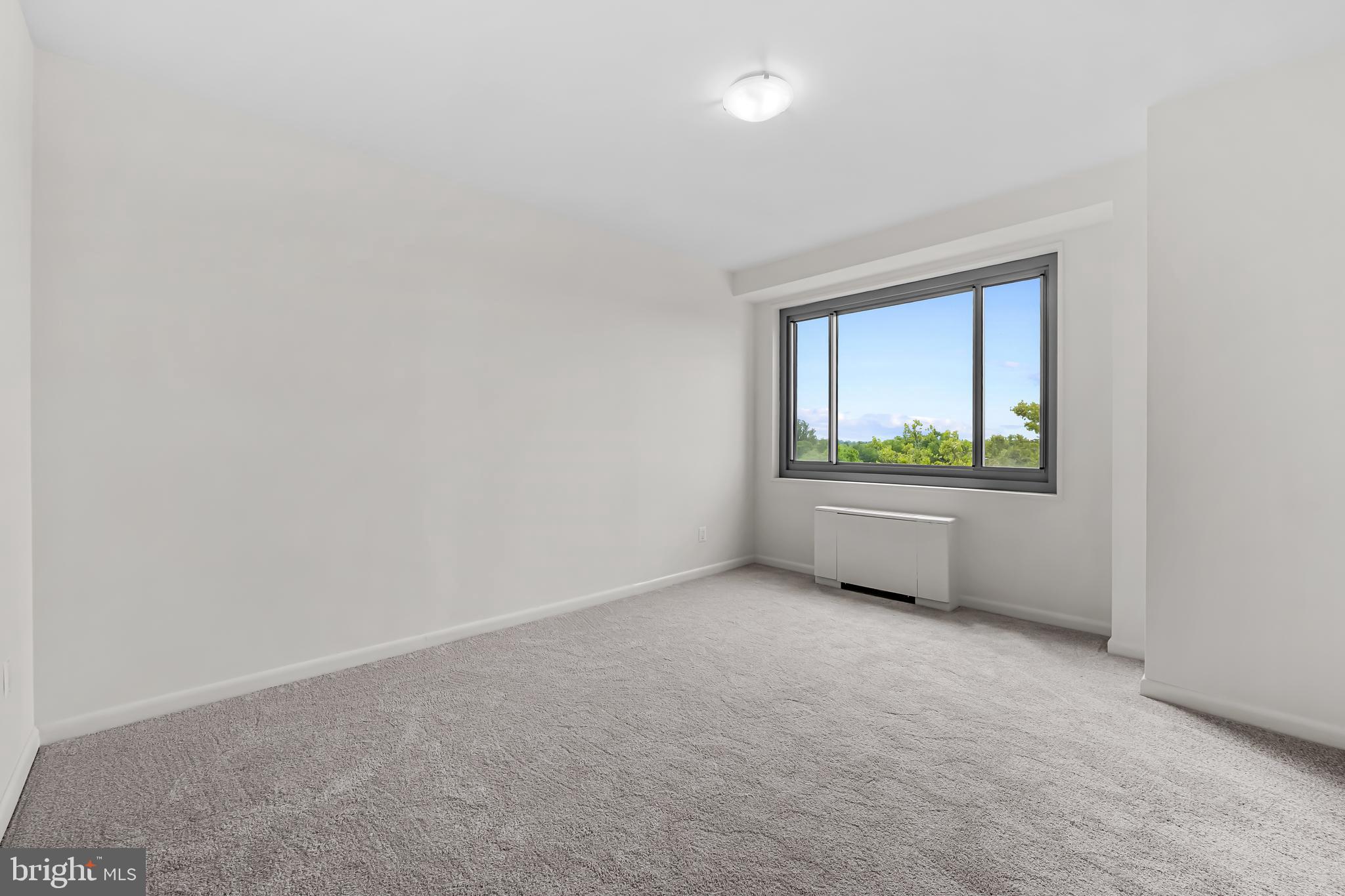 11 Slade Avenue, Unit 911 Baltimore, MD 21208 - Photo 13 of 32 a room with a bench