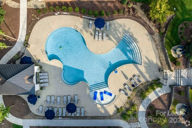 an outdoor view with swimming pool and outdoor seating