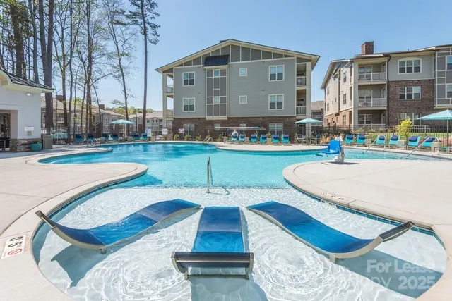 a view of a patio with a table and chairs