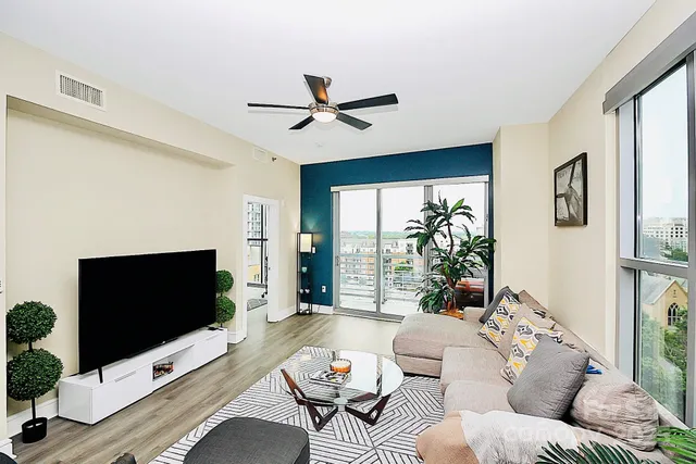 a kitchen with stainless steel appliances kitchen island granite countertop a sink and cabinets