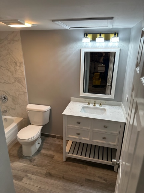 277 Armstrong Drive Buffalo Grove, IL 60089 - Photo 10 of 19 a bathroom with a sink and a mirror