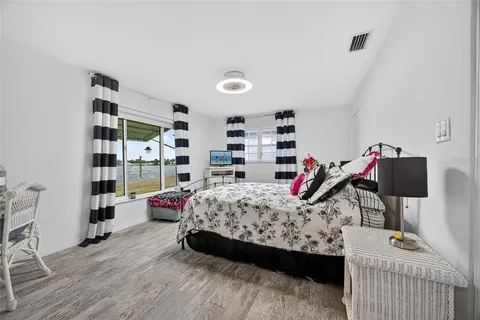 a bedroom with furniture and a book shelf